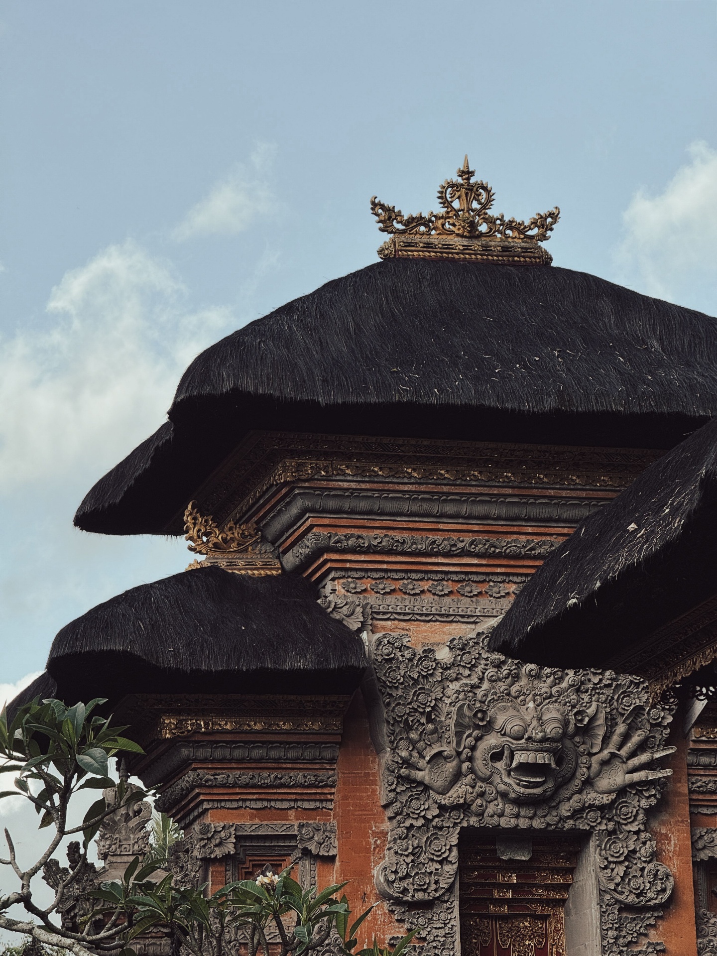Detail of a Balinese temple roof and carving